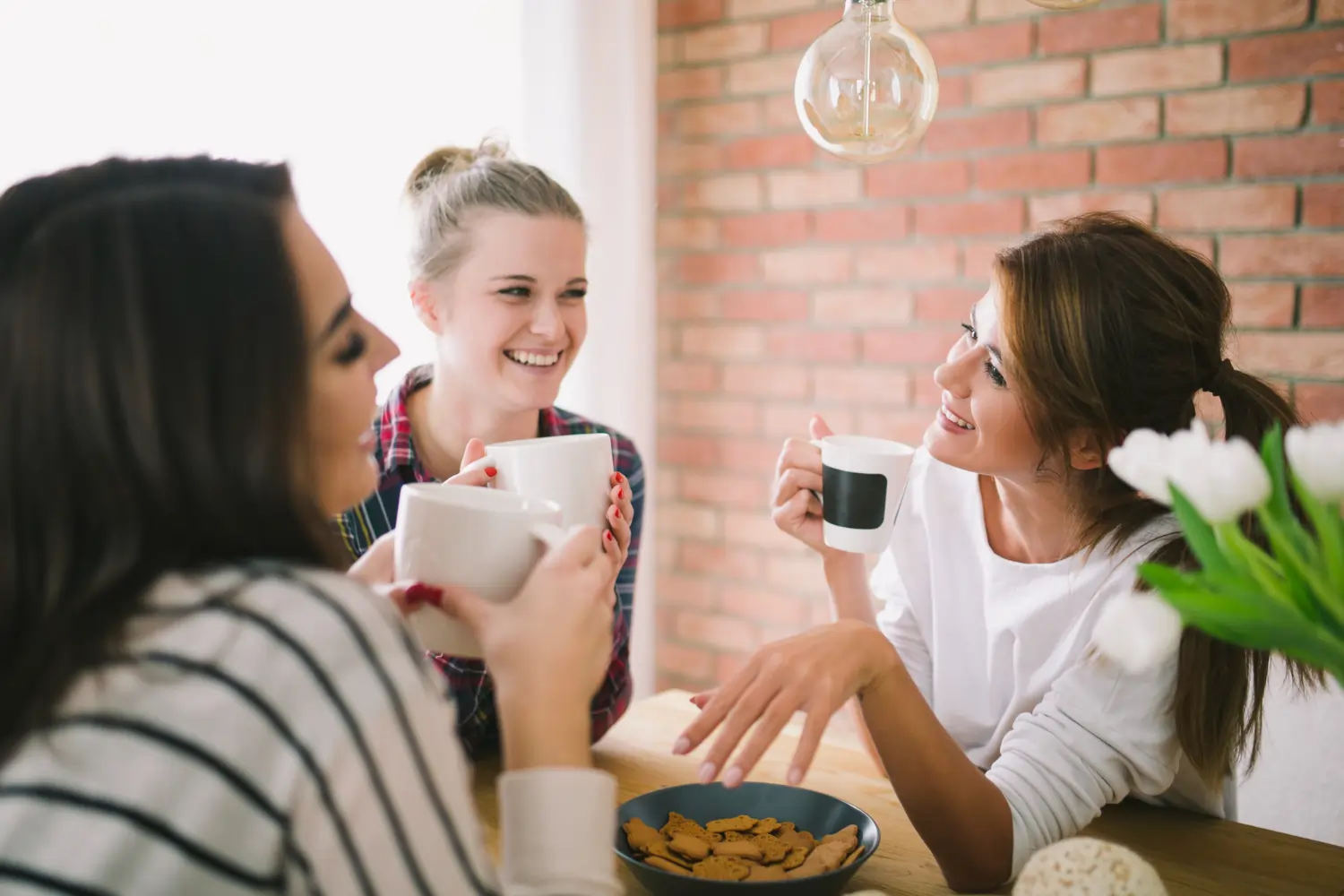 ladies laughing over coffee